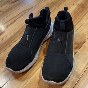 Puma Rebel pull on black athletic shoe. White sidewalls. Size 7.